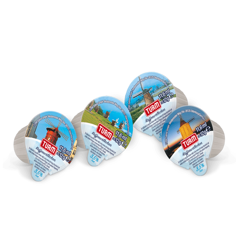 Vier TURM KaffeeWoelkchen Portionspackungen nebeneinander